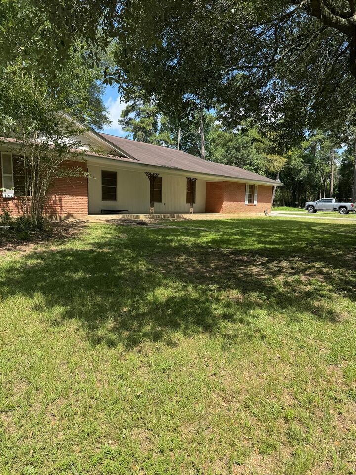 Property Photo:  310 S Highway 150  TX 77331 