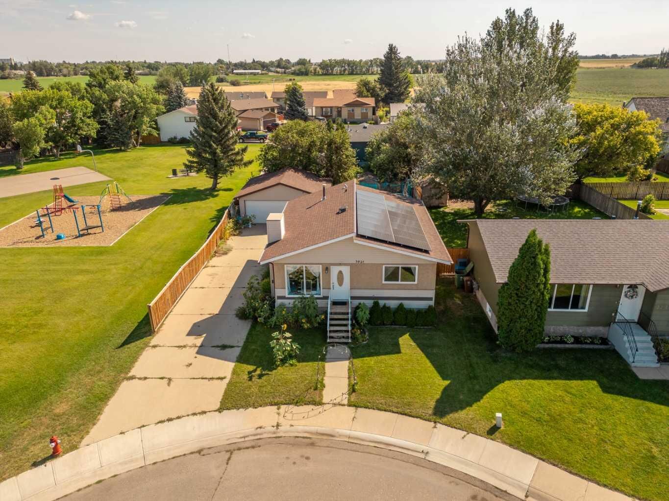Property Photo: 3921 Harmony Place AB T1G 1A2