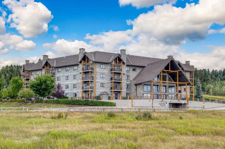Property Photo:  77 George Fox Trail W 117  AB T4C 0N1 