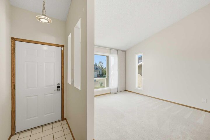 Property Photo:  141 Woodbrook Road SW  AB T2W 6C6 