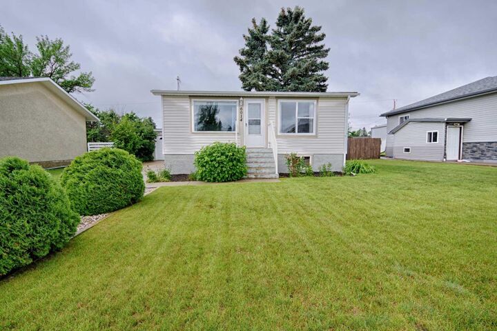 Property Photo:  6014 52 Street  AB T1G 1K4 