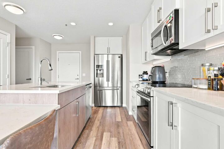 Property Photo: 8530 8A Avenue SW 320 AB T3H 6A7