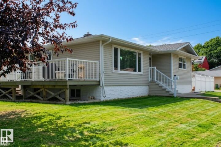 Property Photo:  7703 104 Avenue NW  AB T6A 0J4 
