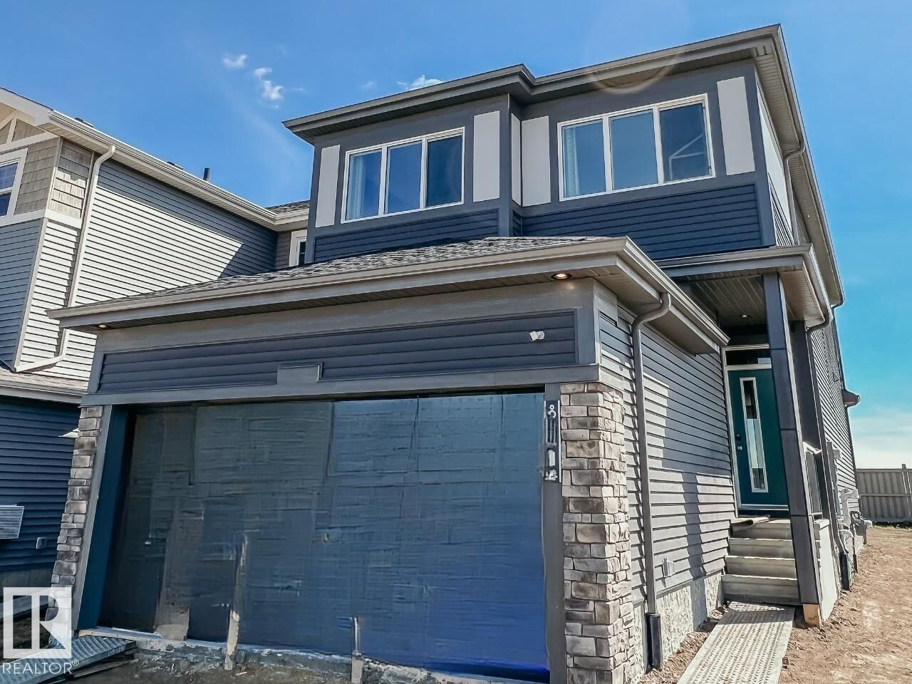 Property Photo:  8331 224 Street NW  AB T5T 7L3 