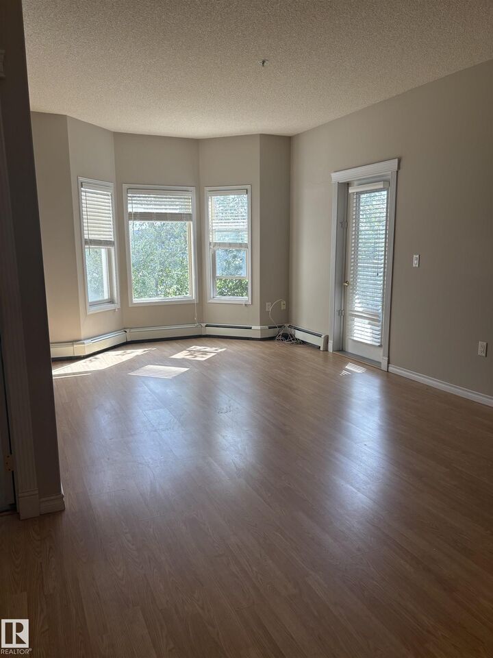 Property Photo:  14259 50 Street NW 212  AB T5G 1R2 