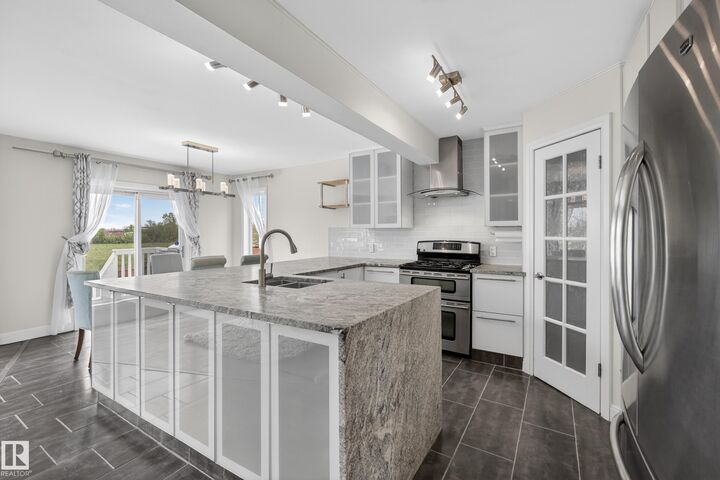 Property Photo:  11827 8 Avenue NW  AB T6J 6Z9 