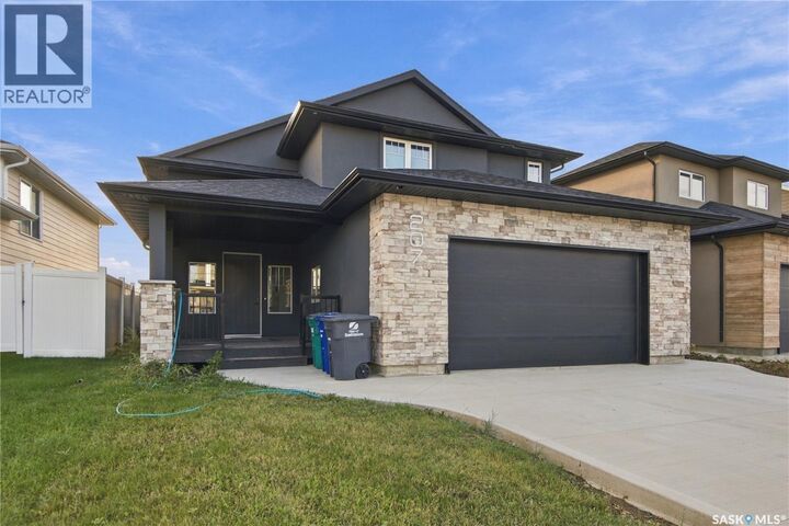 Property Photo:  207 Greyeyes-Steele Way  SK S7V 0M6 