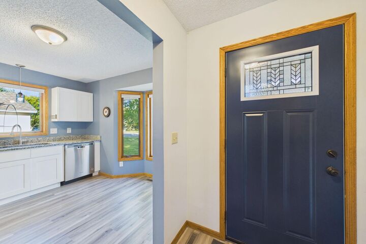 Property Photo:  7081 Upper 36th Street N  MN 55128 