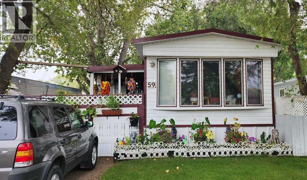 Property Photo:  59 Greenbrook  Mobile Village  AB T1R 0R7 