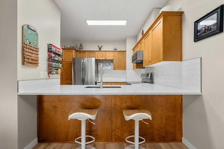 Property Photo:  720 Willowbrook Road NW 1204  AB T4B 2Y9 