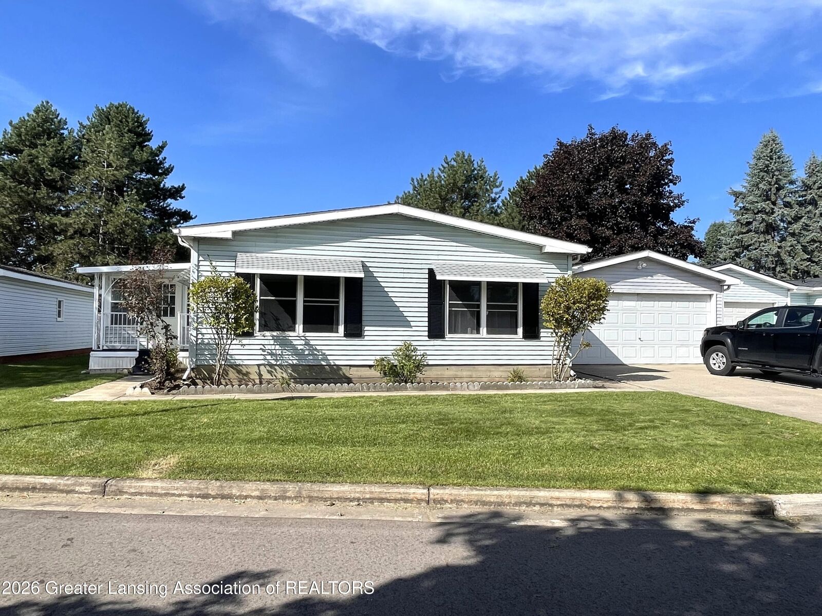 Property Photo:  102 Saint Ives N  MI 48906 