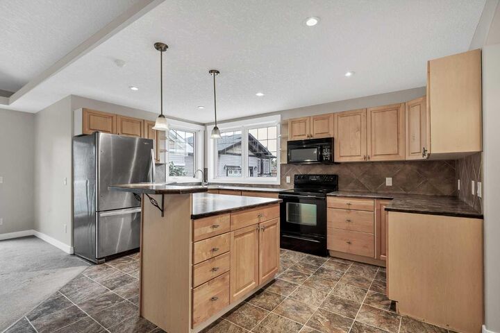 Property Photo:  115 Strathmore Lakes Common  AB T1P 1Y7 