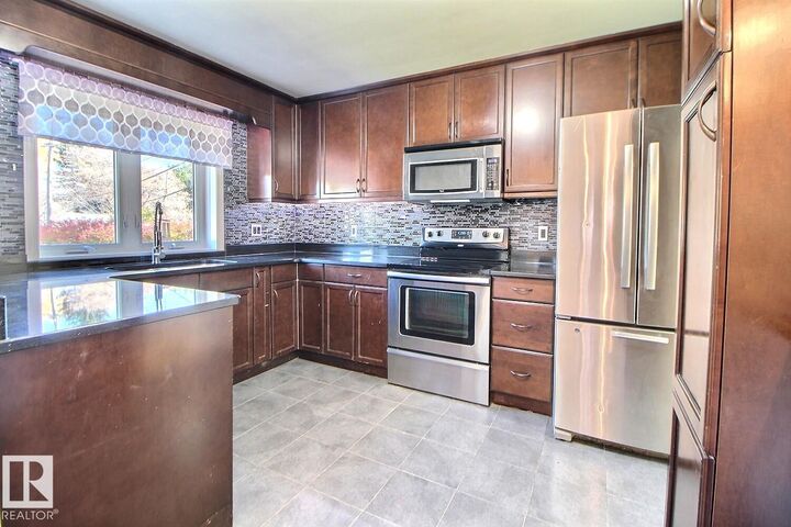 Property Photo:  11511 135 Street NW  AB T5M 1K9 