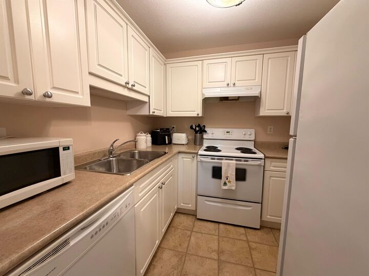 Property Photo:  33598 George Ferguson Way 302  BC V2S 2L8 