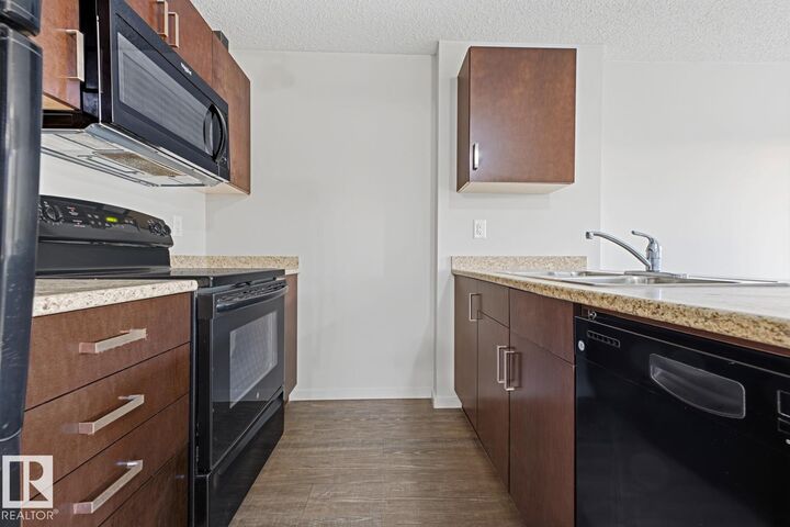 Property Photo:  5521 7 Avenue SW 303  AB T6X 2A8 