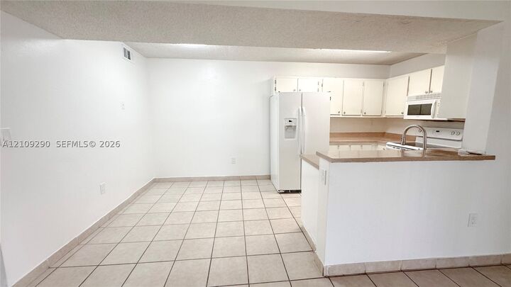 Property Photo:  9491 S Palm Cir S 103  FL 33025 