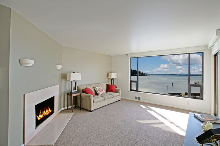 Property Photo: The living room with incredible views 9717 NE Juanita Dr 402 WA 98034