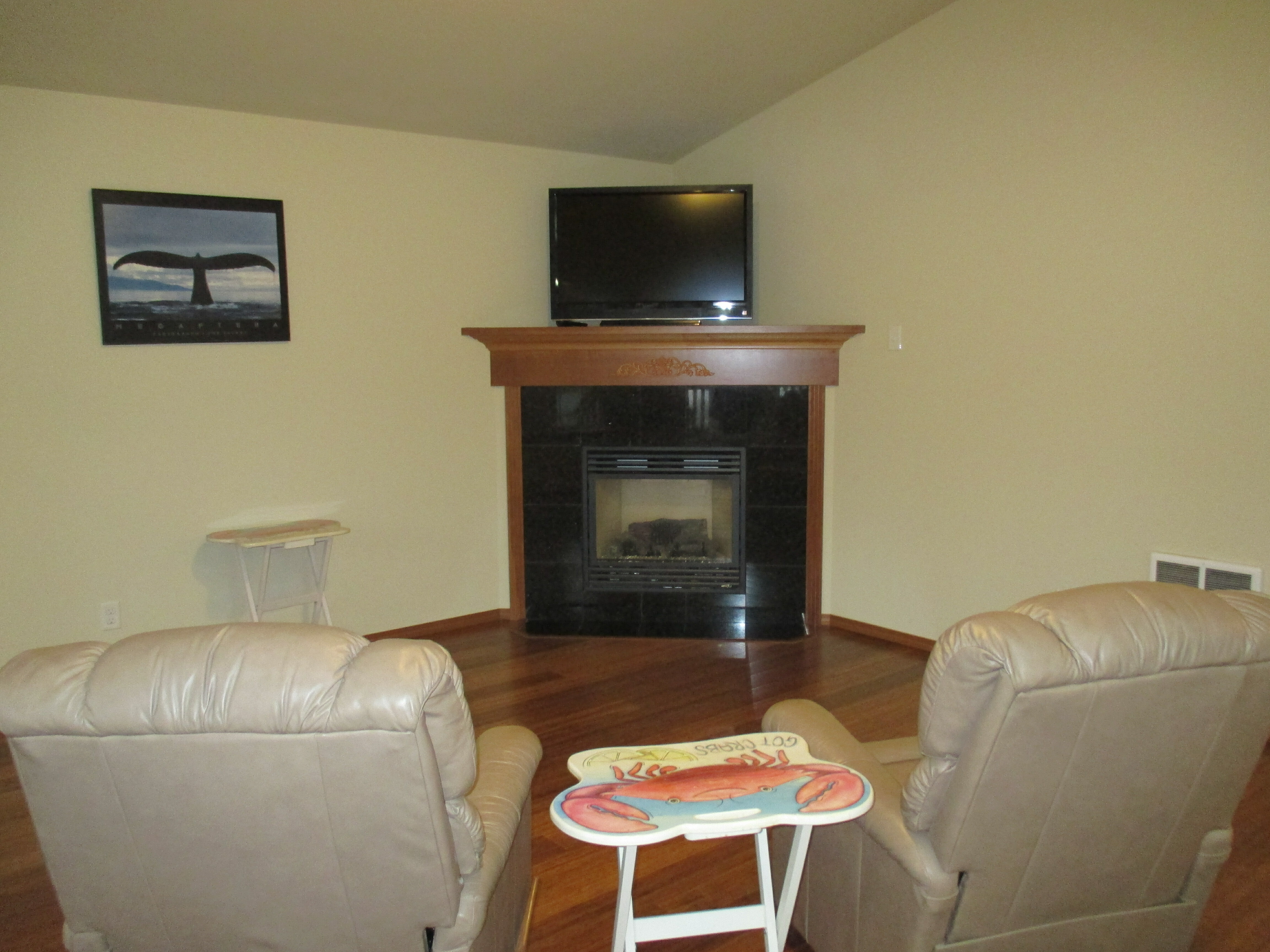 Property Photo: Living area with pretty corner fireplace. 169 N Narwhal Lp NW  WA 98569 