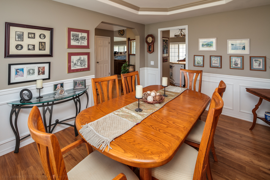 Property Photo: To the right of the entry is the formal dining area with its chair rail, wainscoting, and coffered ceilings. it opens to the entry on the lest and the kitchen beyond. 537 Sunrise Dr  WA 98264 