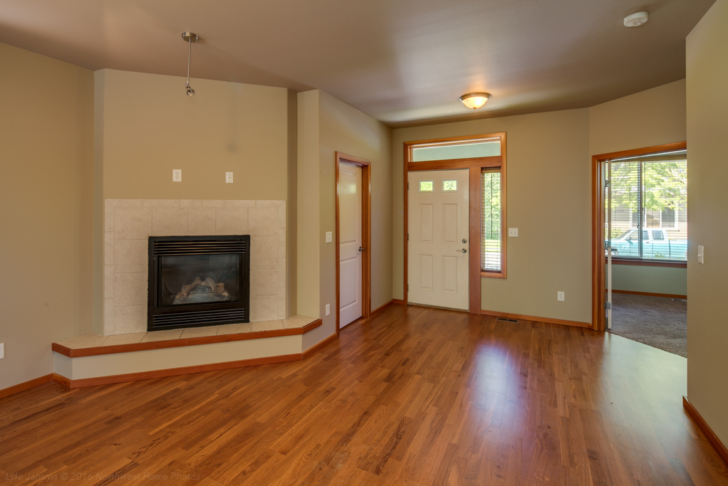 Property Photo: Looking toward the front entry with the den/office to the right and the gas fireplace to the left, with a nice hearth for additional seating. 2098 Calico Lp  WA 98248 