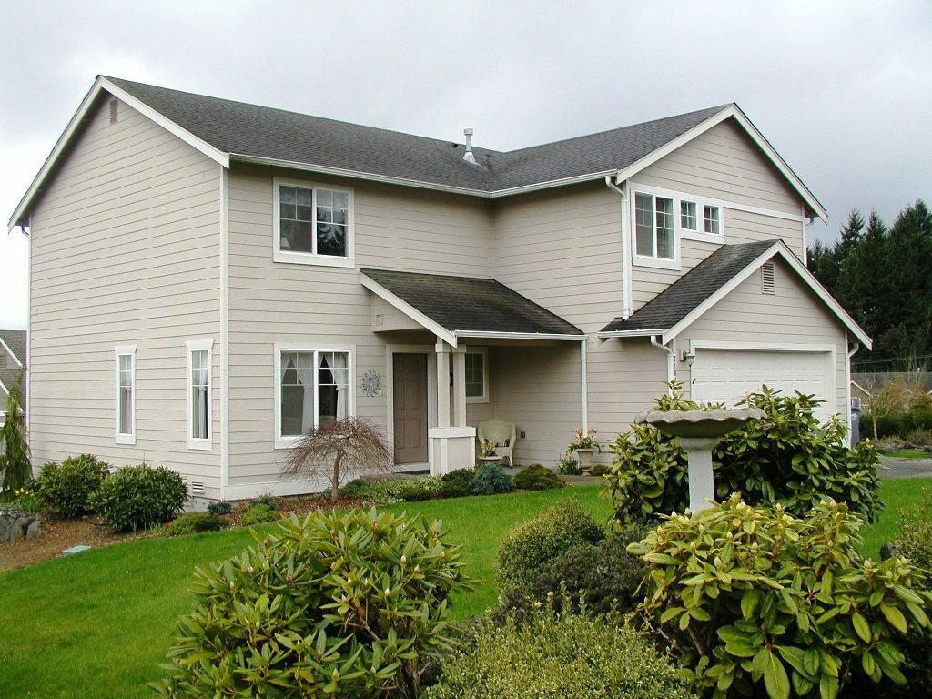 Property Photo: Home exterior, deck porch and grounds 7104 58th Stct W  WA 98467 